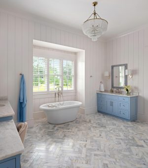Master bathroom in Palmetto Bluff with freestanding tub and blue vanity.